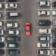 Top view of the crowded Parking lot with quadcopter or drone.